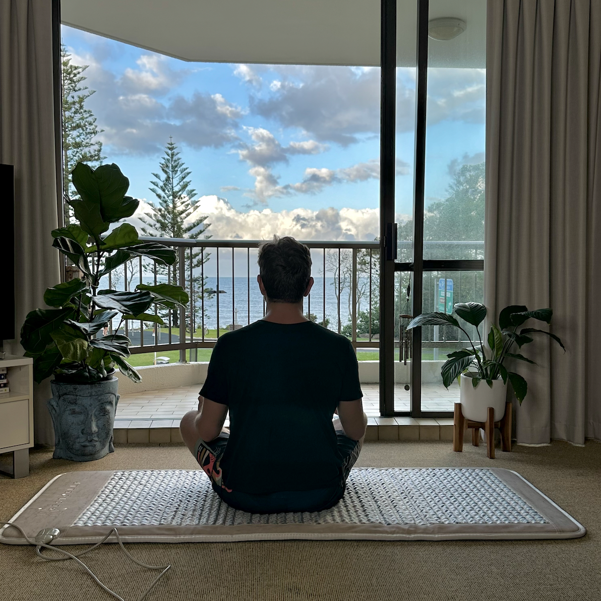 Filipe Meditating on Full body Infrared PEMF Mat