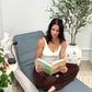 Stephanie reading on the BEST CELLF PEMF therapy Mat 